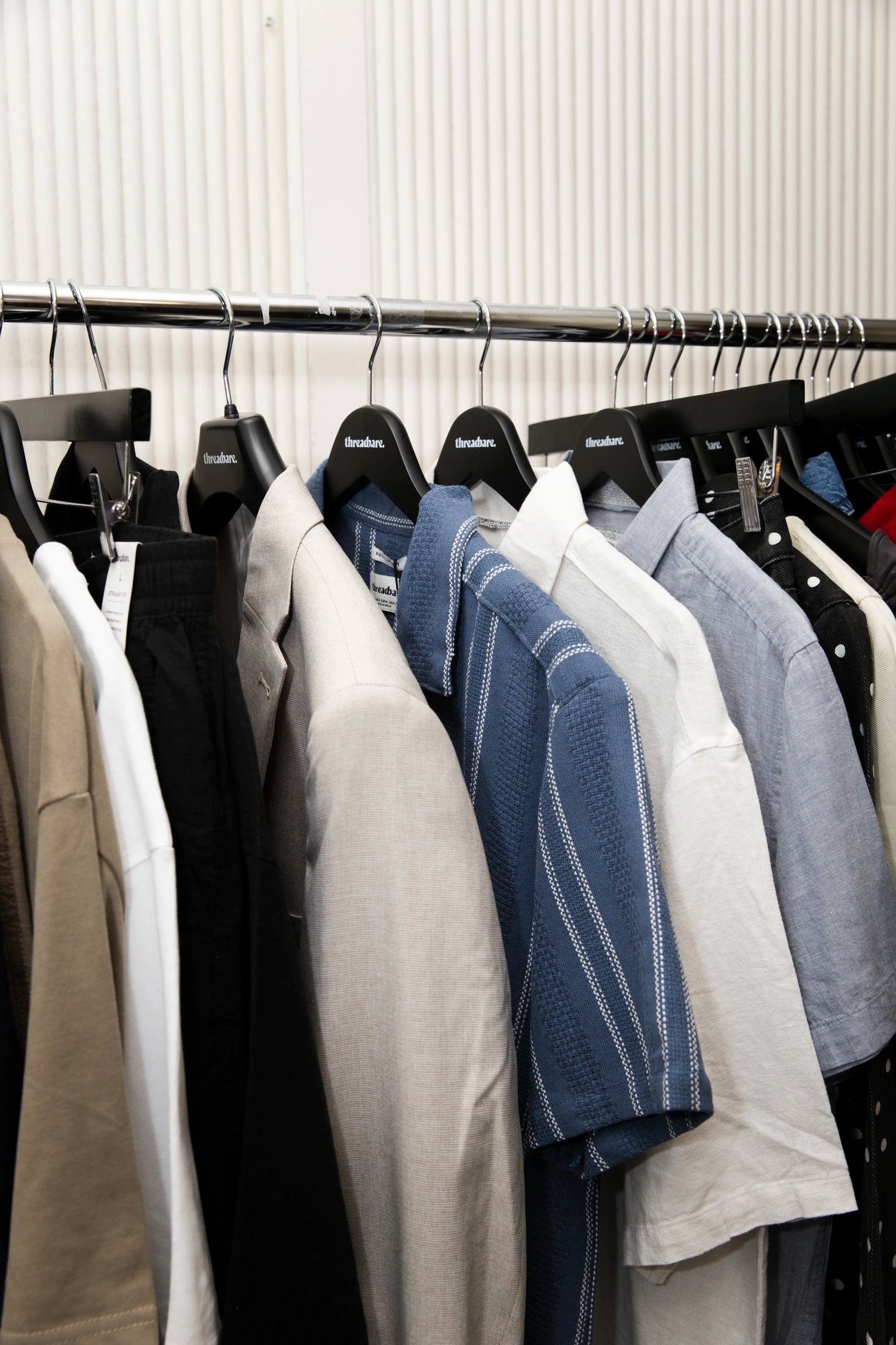 A rail with Threadbare menswear short sleeve shirts, T-shirts and jackets