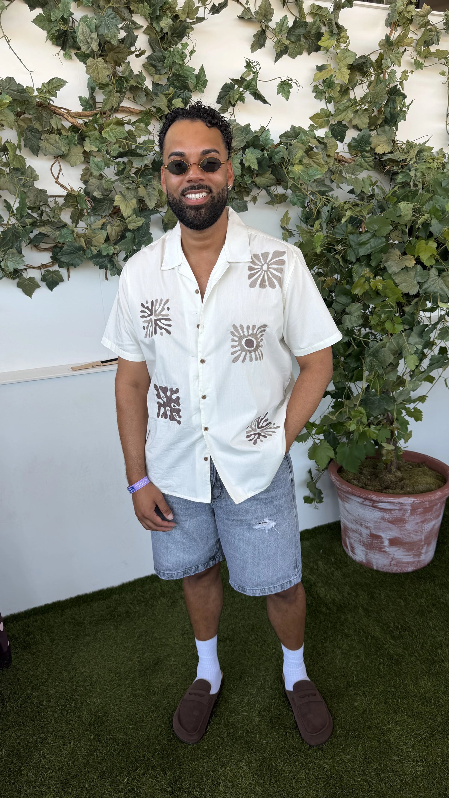 Jordan in our Patch Embroidered Cotton Poplin Short Sleeve Shirt in Ecru & our Faux Suede Penny Loafer Sandals in Brown