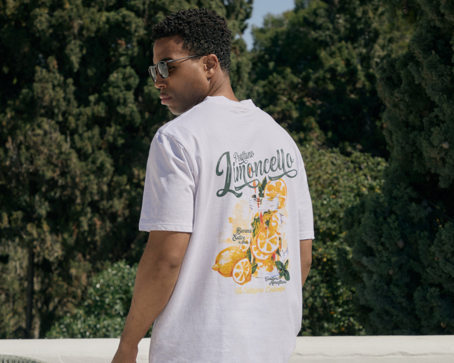 Threadbare Relaxed Fit Limoncello Cotton T-Shirt in White worn by man in sunglasses