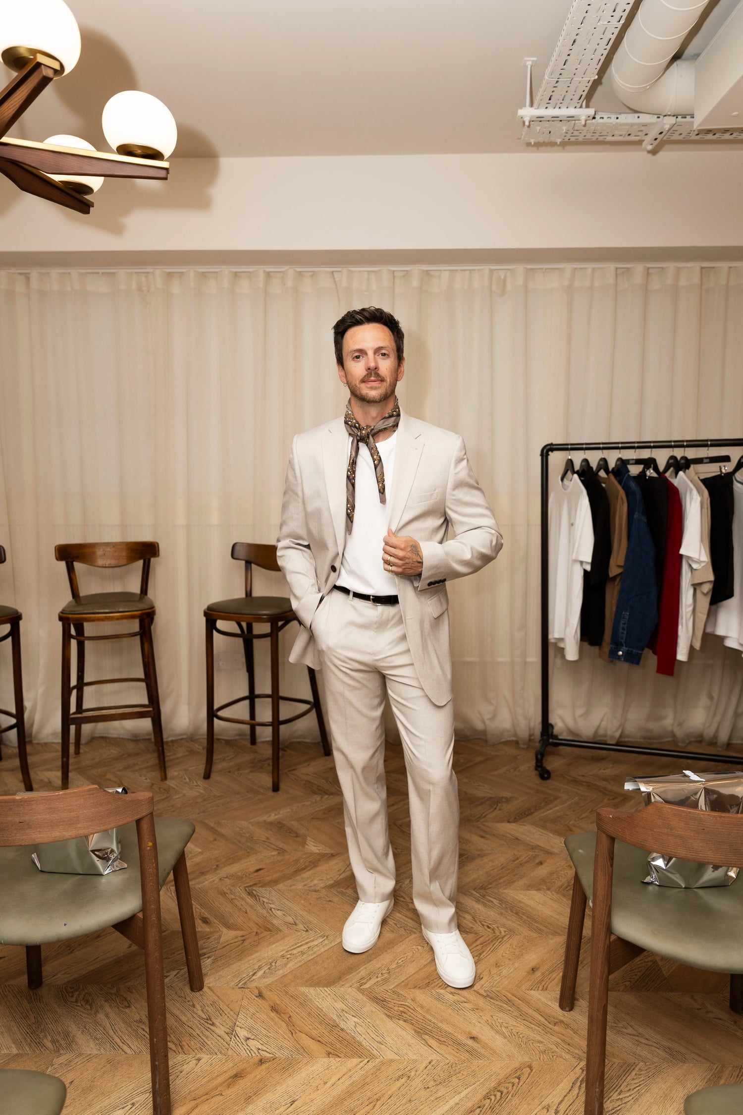 Nick Howard Lanes wearing Threadbare's Tailored Fit Single Breasted Blazer and Tailored Fit Suit Trousers in Stone.