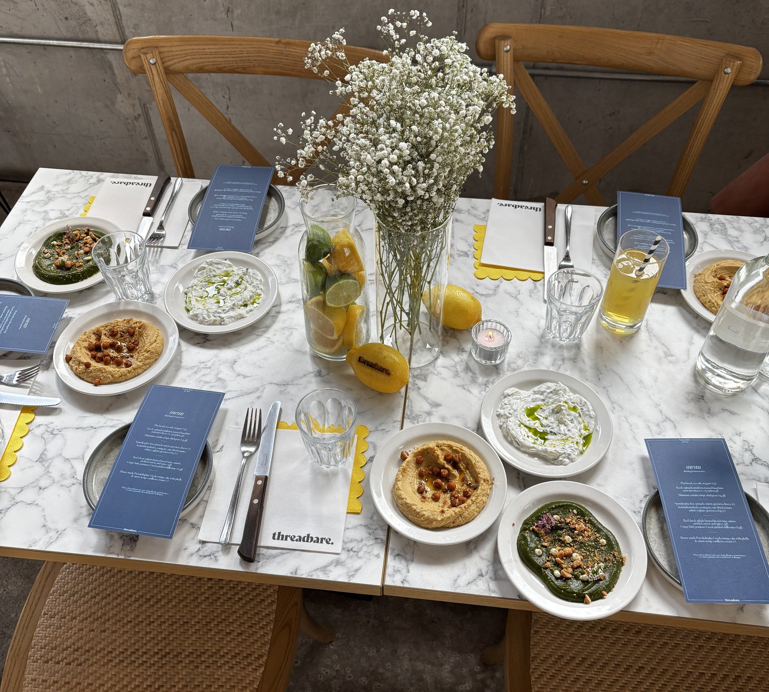 Greek food laid out on a table at Kallos Manchester
