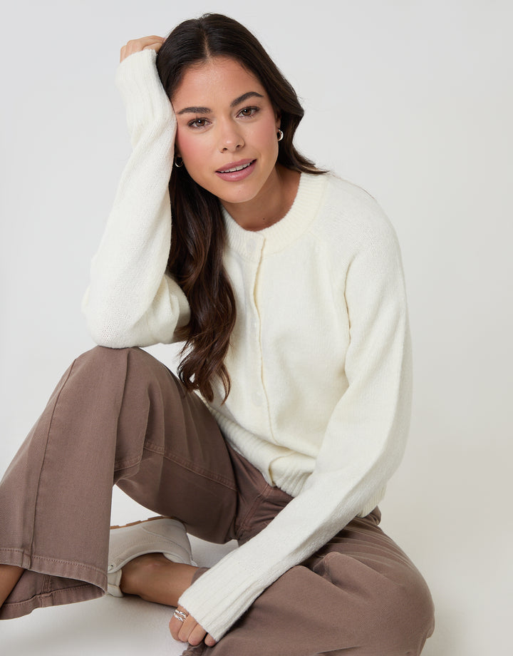 Threadbare Button Up Knitted Cardigan in Cream - seated
