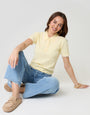 Threadbare Pointelle Knit Scalloped Polo Shirt in Lemon Yellow - seated