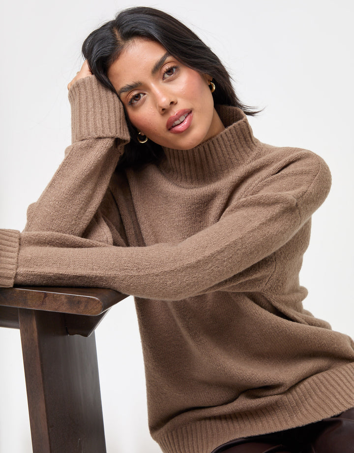 Threadbare Relaxed Fit Funnel Neck Jumper in Beige - sat down