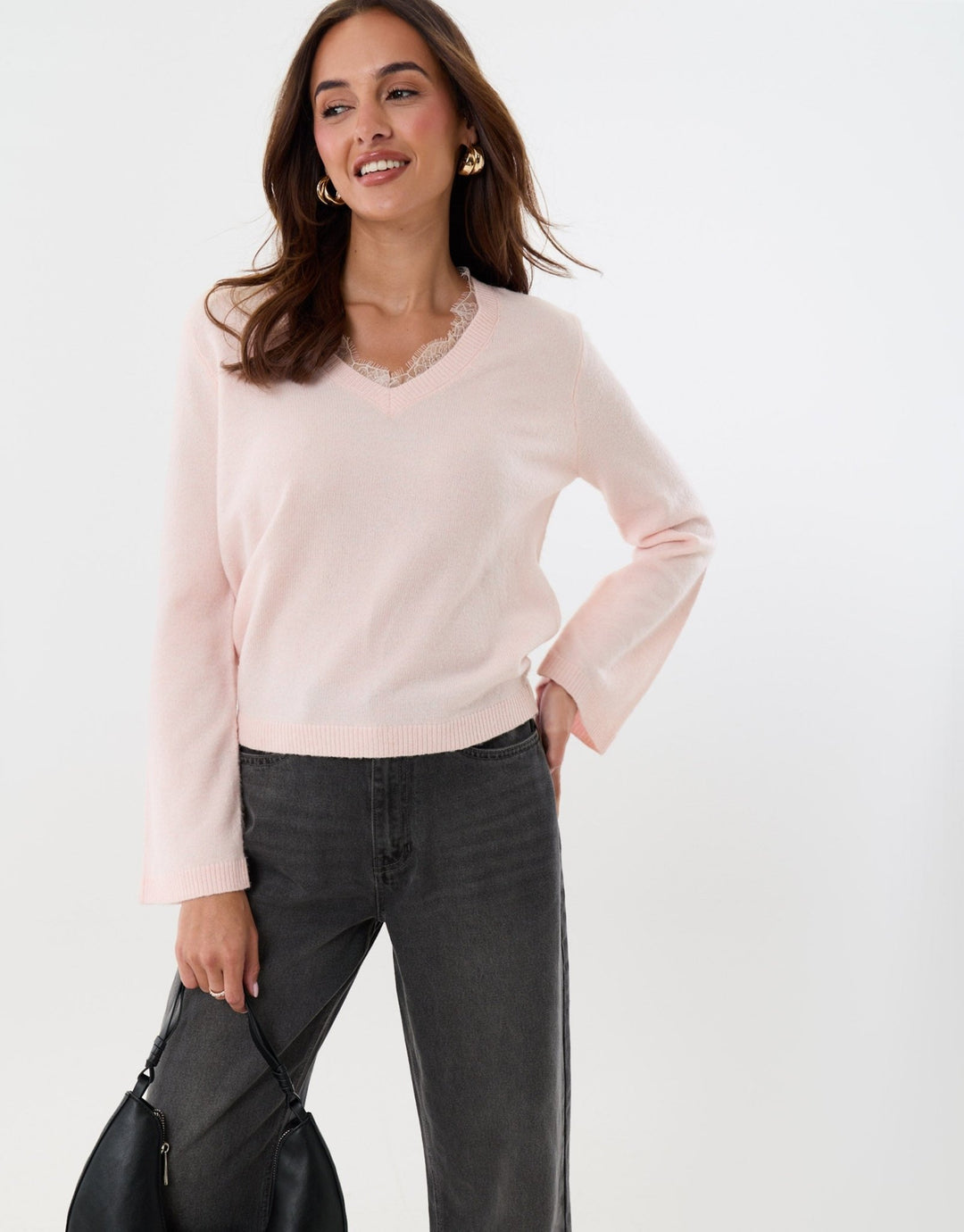 Threadbare Lace Detail V Neck Jumper in Pink - hand on hip front view