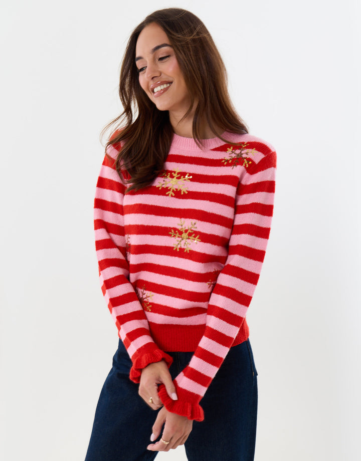 Threadbare Sequin Snowflake Christmas Jumper in Pink & Red Stripe - front view hand on hip