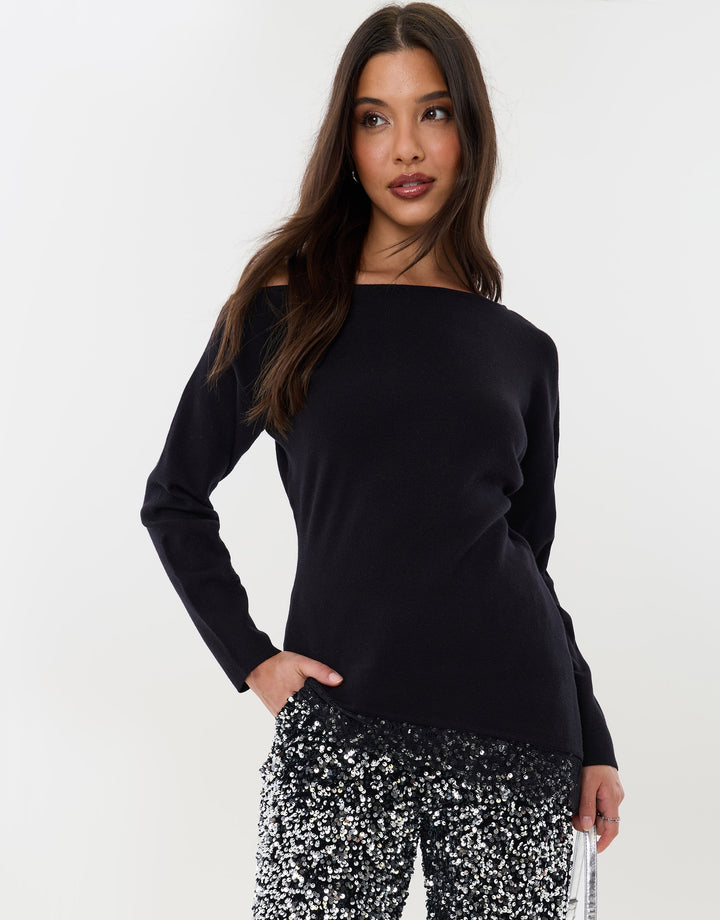 Threadbare Lace Hem Slash Neck Jumper in Black - hand on hip view