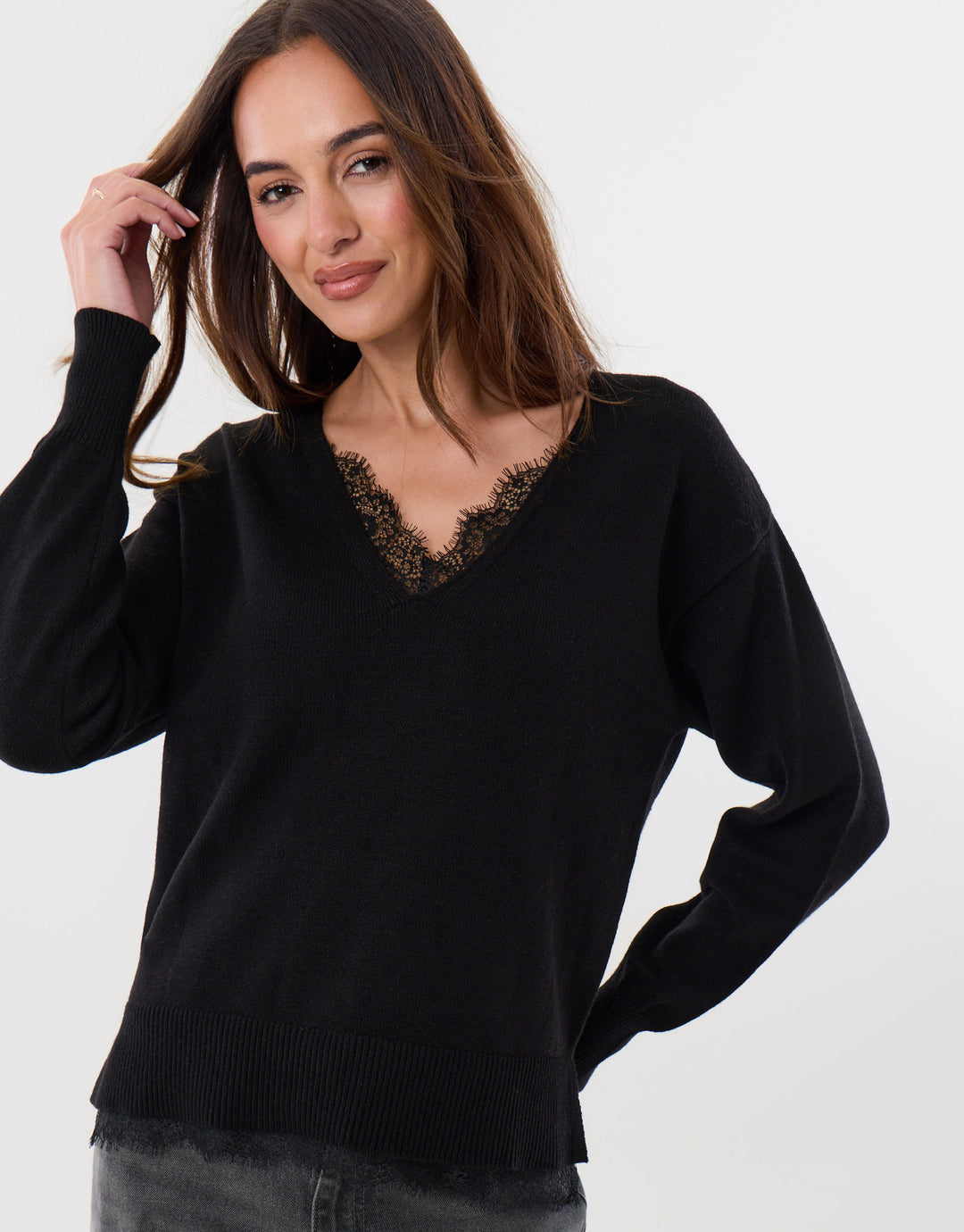 Threadbare Lace Detail V Neck Jumper in Black - hand on hip front view