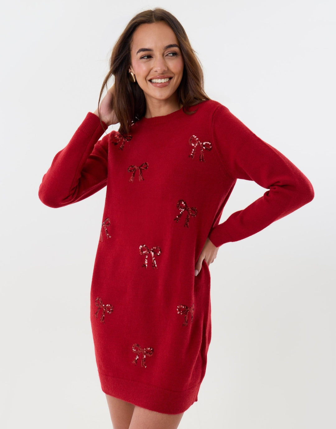 Threadbare Bow Embellished Knitted Mini Dress in Red - hand on hip front view