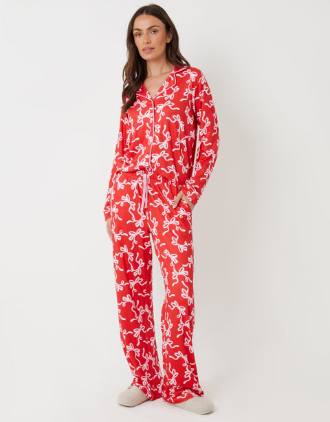 Threadbare Long Button-Through Christmas Pyjama Set in Red Bow Print - front view
