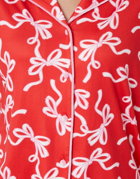 Threadbare Long Button-Through Christmas Pyjama Set in Red Bow Print -  buttons close up