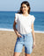 Raw Hem Denim Bermuda Shorts in Light Wash