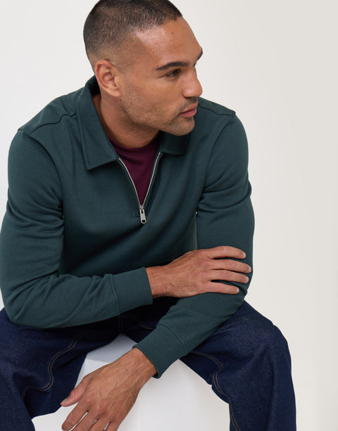 Threadbare Cotton Rich Quarter Zip Polo Sweatshirt in Forest Green - sat down
