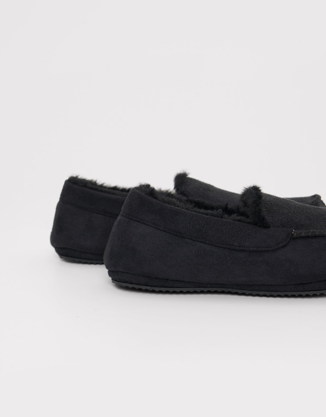 Faux Fur Lined Moccasin Slippers in Black