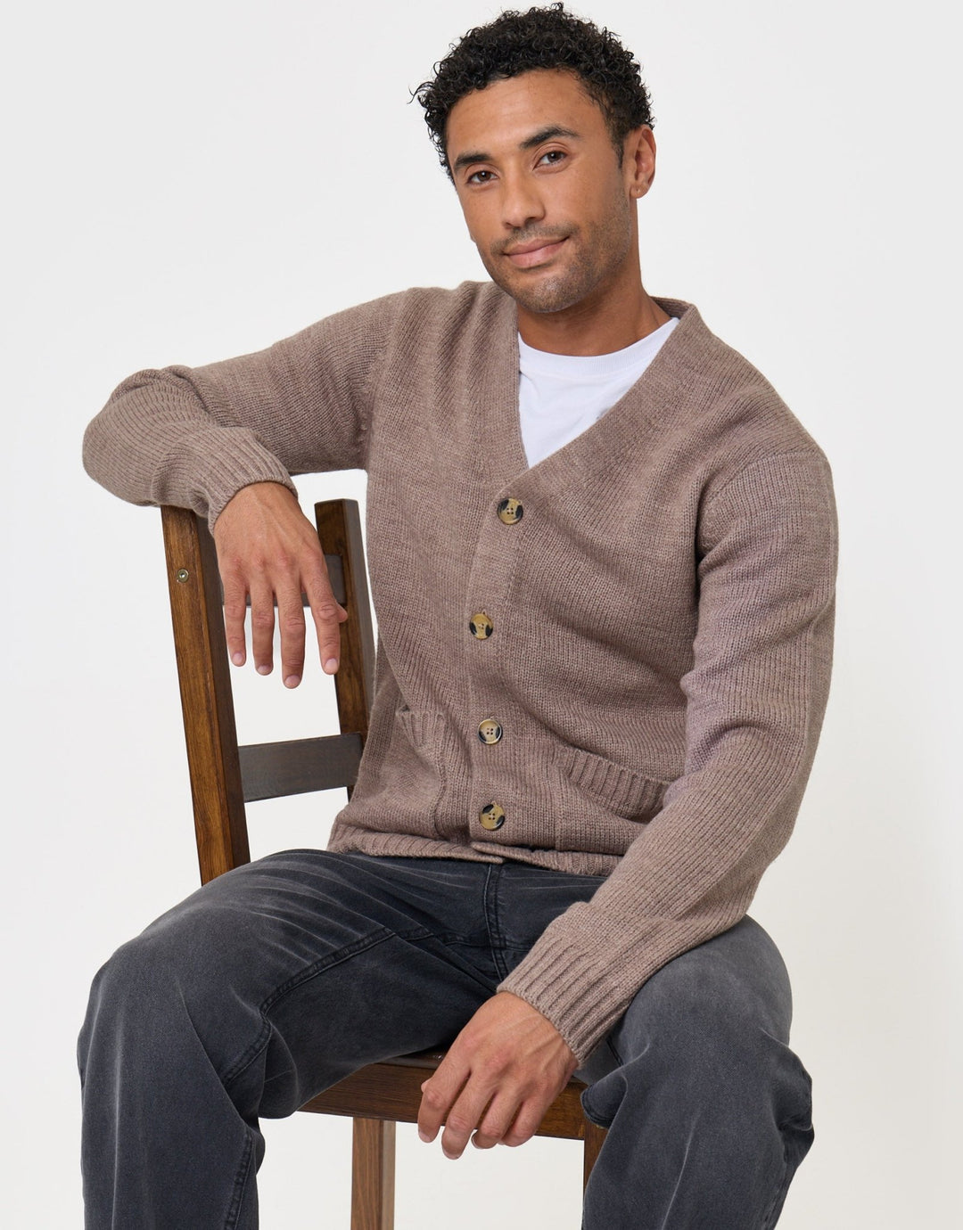 Threadbare Knitted V-Neck Cardigan in Cream - sat down