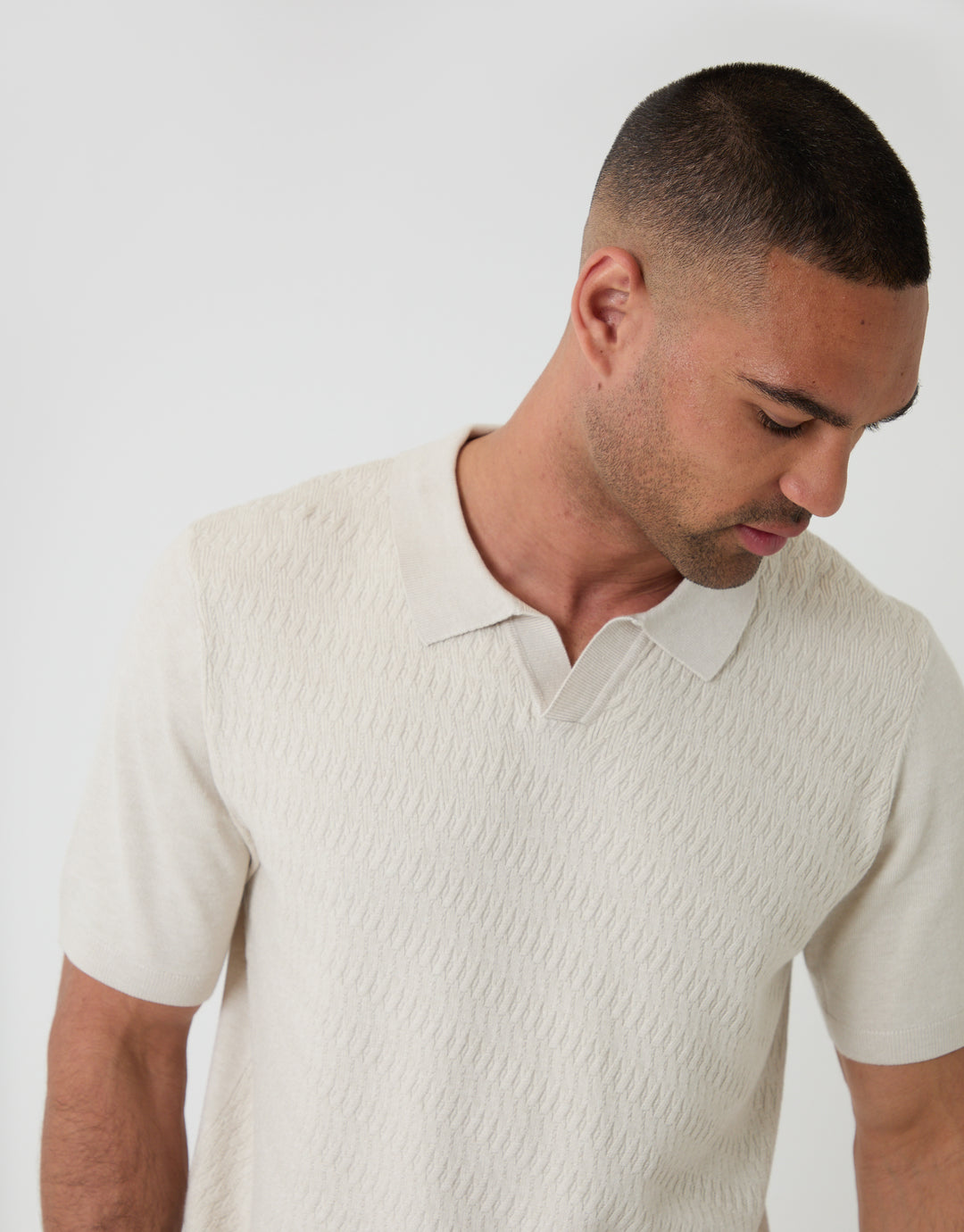 Threadbare Textured Knit Front Trophy Neck Polo in Ecru - front detail chest view