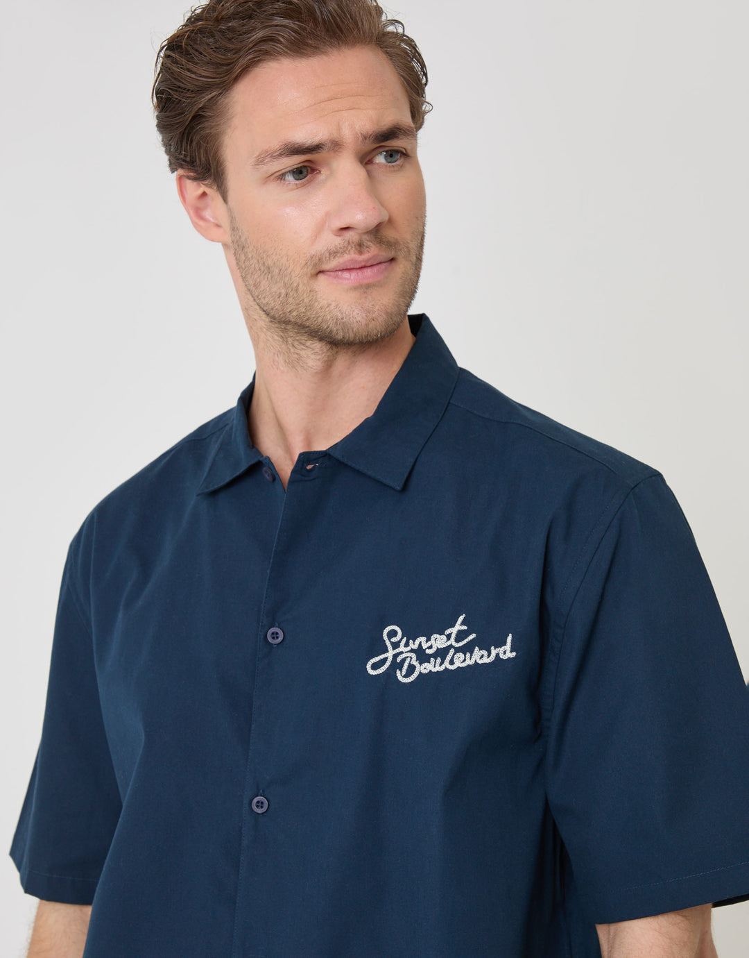 Threadbare Boxy Fit Sunset Boulevard Embroidered Short Sleeve Shirt in Navy - close up