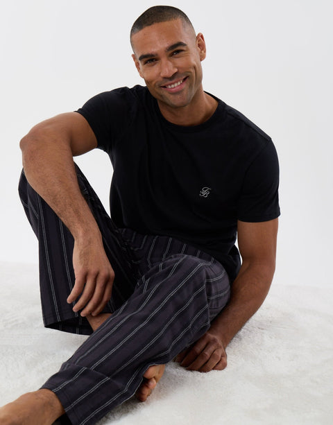 Threadbare T-Shirt & Cotton Flannel Trousers Pyjama Set in Black Stripe - sat down