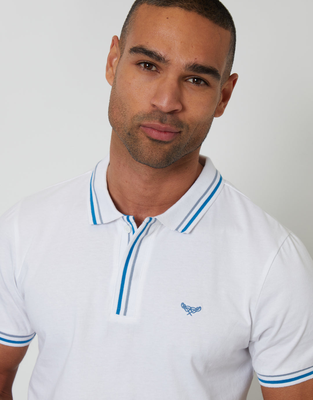 Threadbare Contrast Tipping Hidden Placket Polo Shirt in White - front view close up