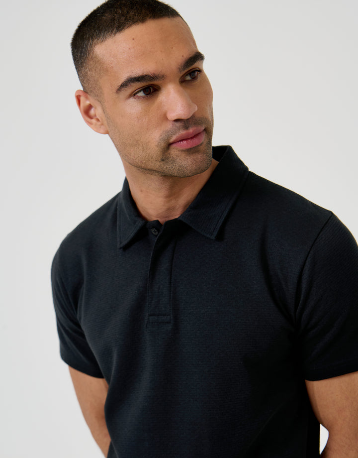 Threadbare Textured Hidden Placket Polo Shirt in Black - front view close up