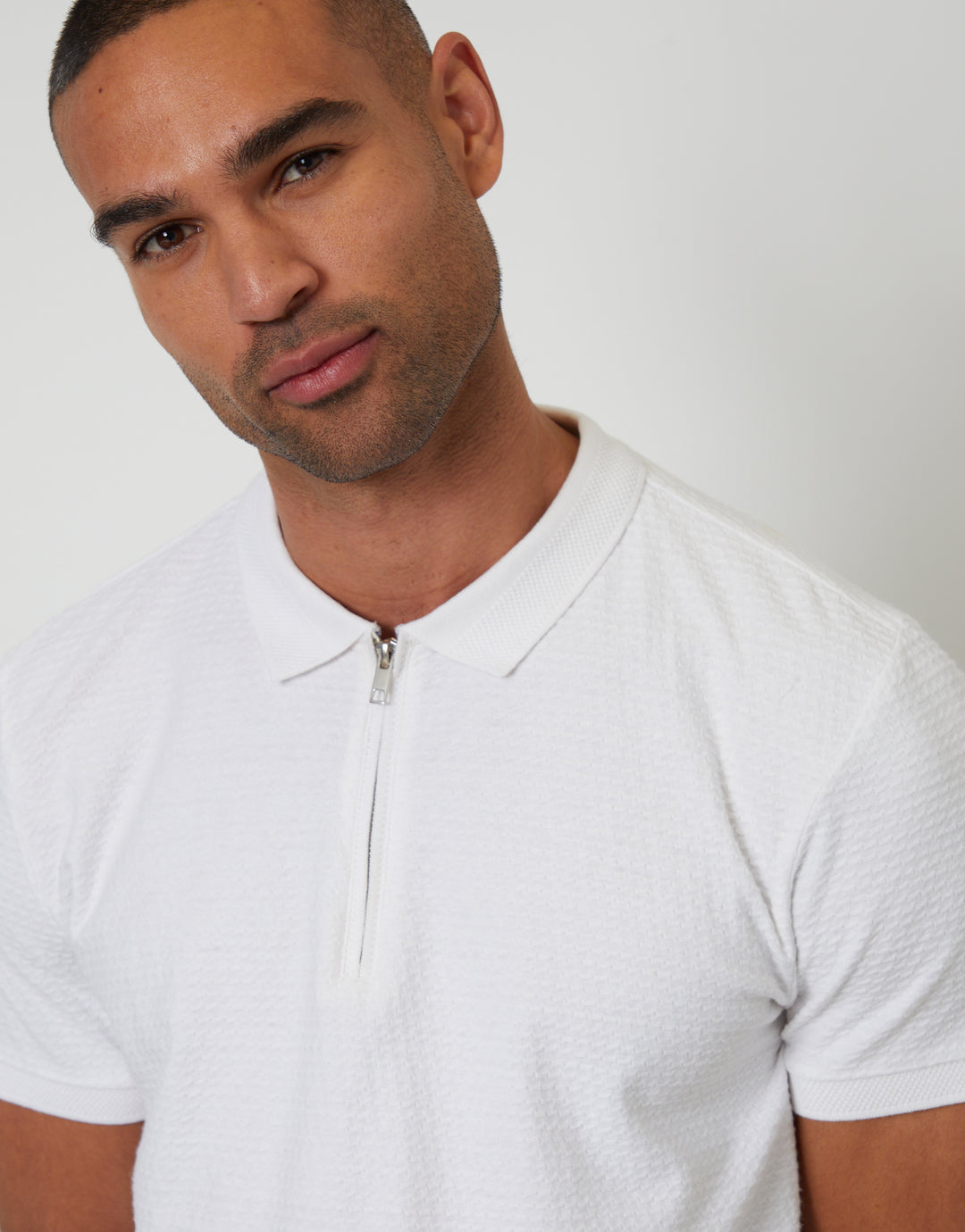 Threadbare Textured Quarter Zip Polo Shirt in White - front view close up