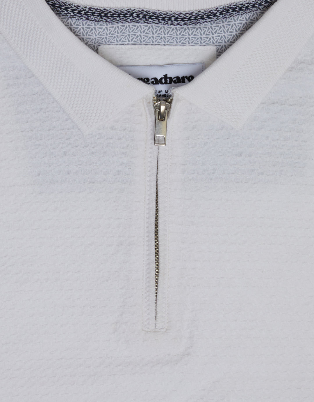 Threadbare Textured Quarter Zip Polo Shirt in White - collar close up