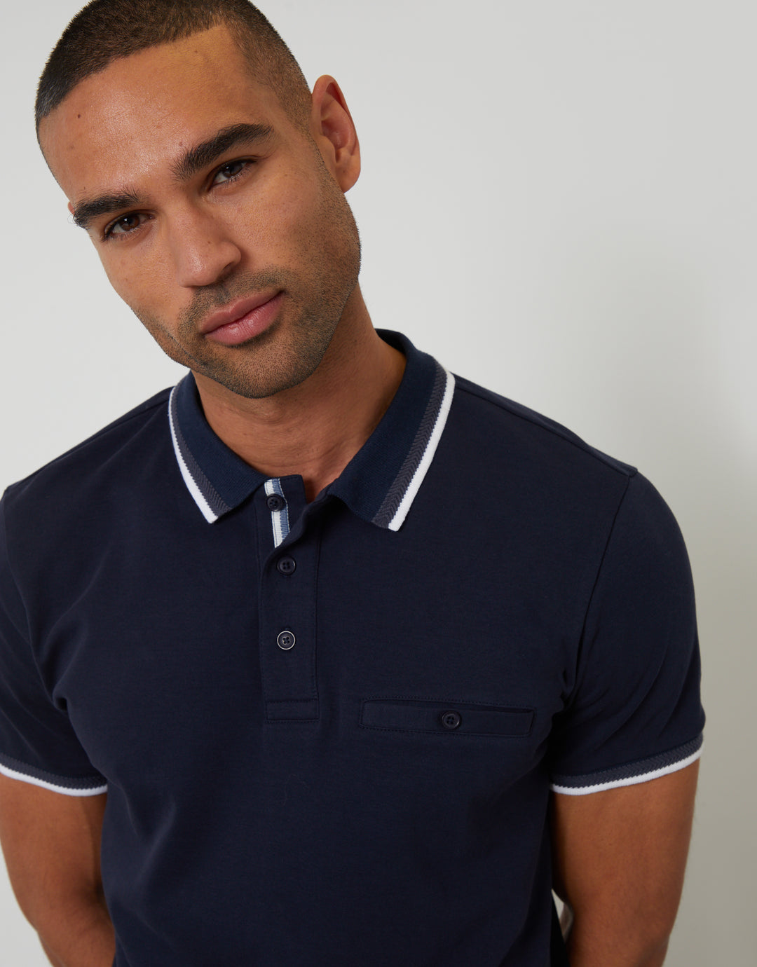 Threadbare Jetted Pocket Cotton Interlock Polo Shirt in Navy - front view close up