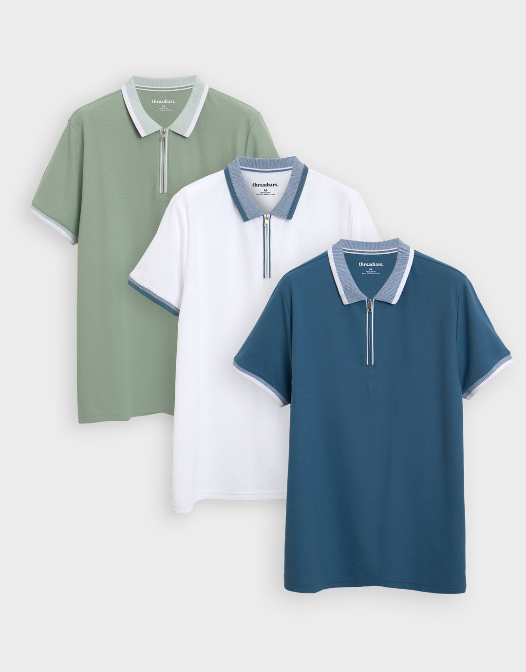 Threadbare 3 Pack Pique Tipping Collar Quarter Zip Polo Shirts in Sage Green, White & Denim Blue - 3-pack flat lay