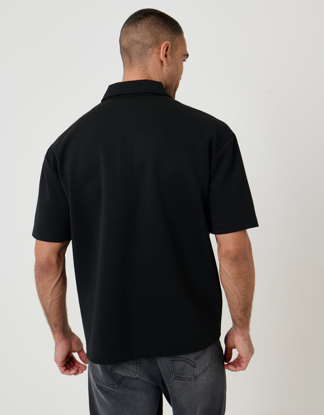 Threadbare Oversized Quarter Zip Polo Shirt in Black - back view