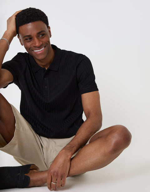 Threadbare Textured Cotton Polo Shirt in Black - sat down