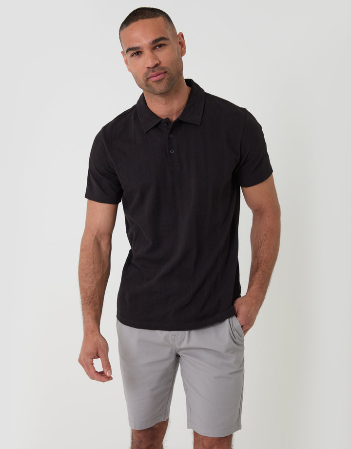 Threadbare Textured Cotton Polo Shirt in Black - front view