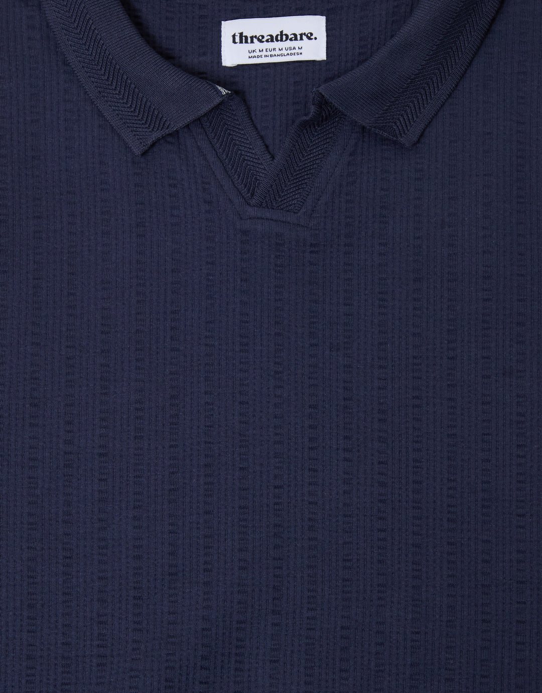 Threadbare Trophy Neck Textured Stretch Cotton Polo Shirt in Navy - close up