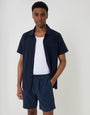 Threadbare Shorter Length Stripe Cotton Shorts in Navy - front view, hand in pocket