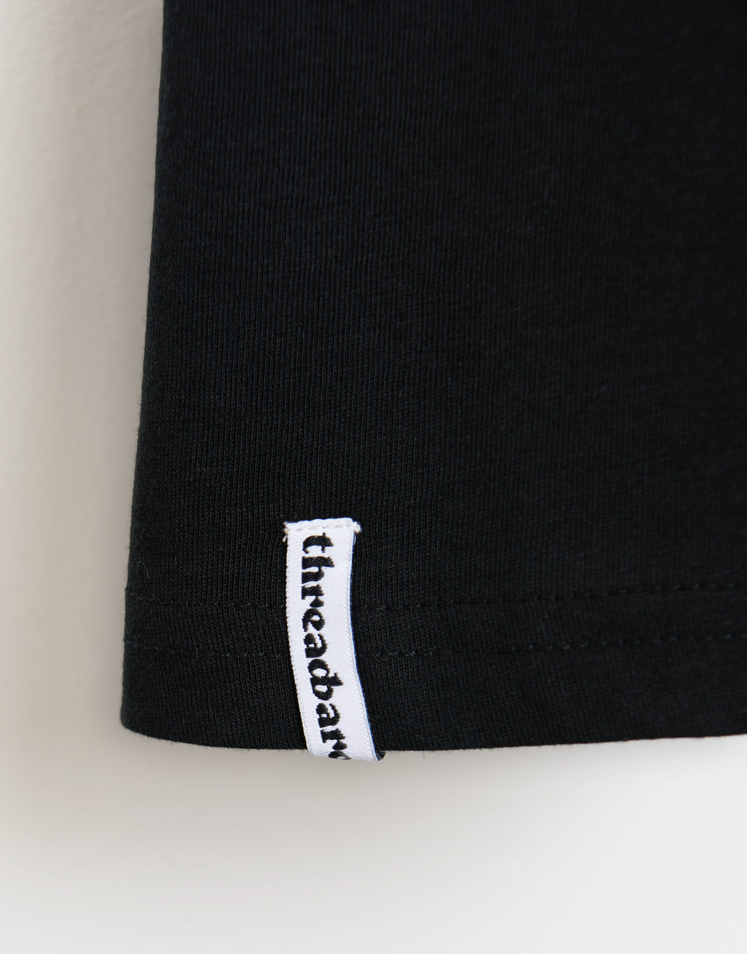 Threadbare Cotton Crew Neck T-Shirt in Black - woven branded hem label detail