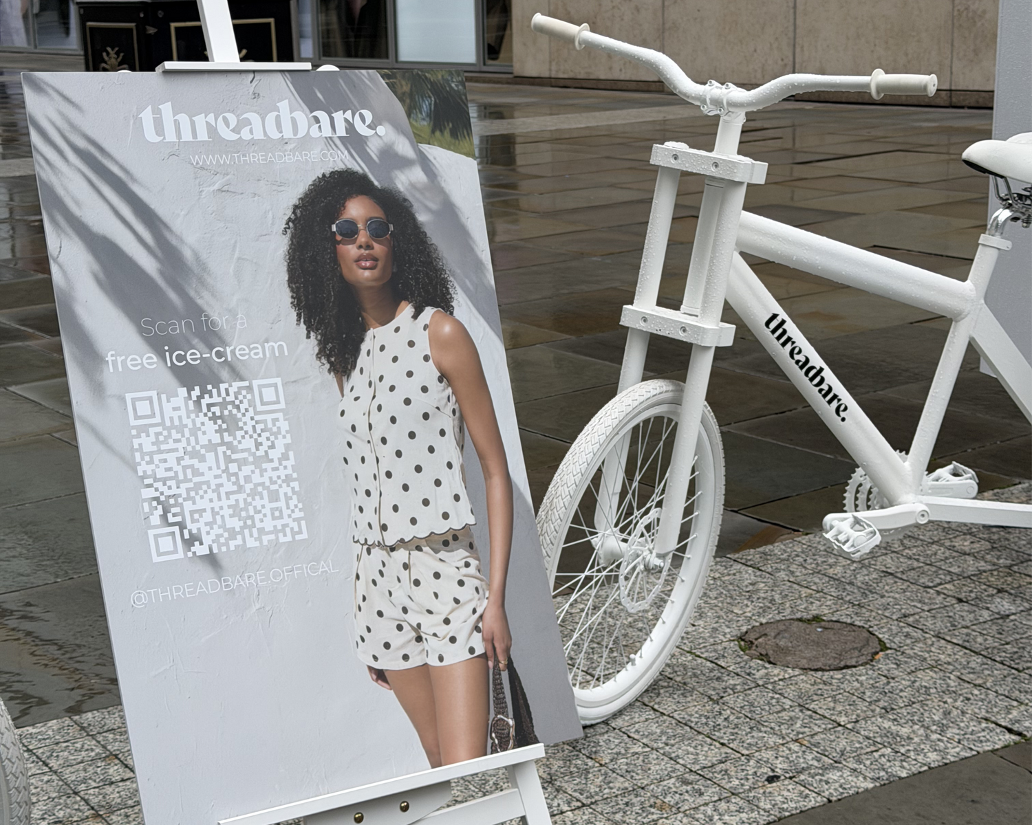 Sign stating Scan for free ice-cream next to a Threadbare branded bicycle